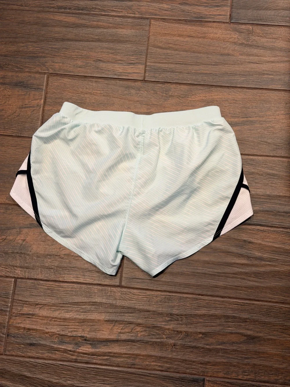 Under Armour Women's light blue Athletic Shorts with Black Trim, size S running